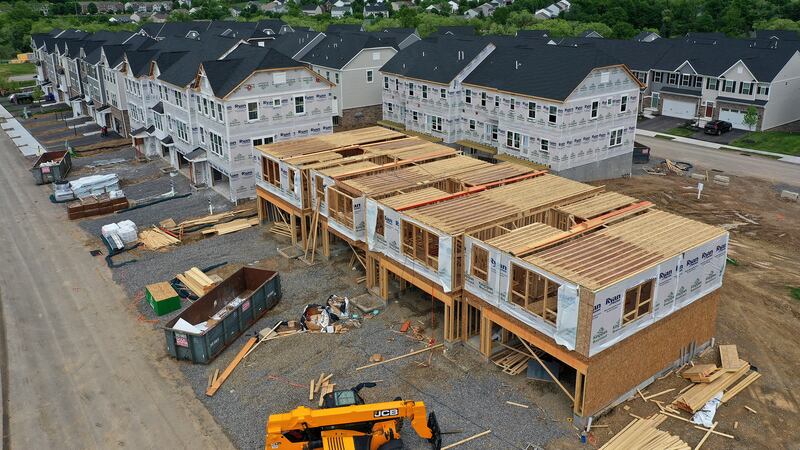 File - Townhomes under construction are shown in Mars, Pa., on May, 27, 2022. On Thursday,...