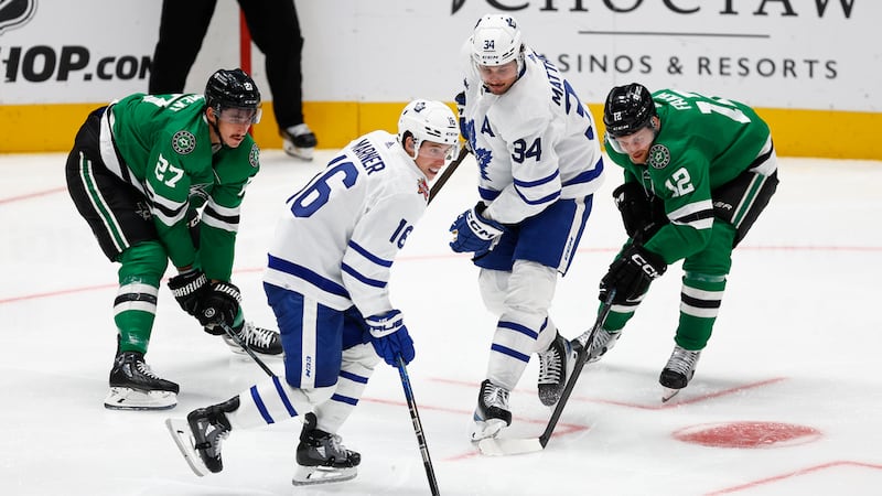 Dallas Stars forwards Mason Marchment (27) and Radek Faksa (12) battle Toronto Maple Leafs...