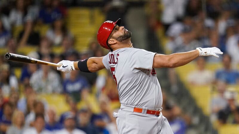 St. Louis Cardinals designated hitter Albert Pujols (5) hits a foul ball during the first...