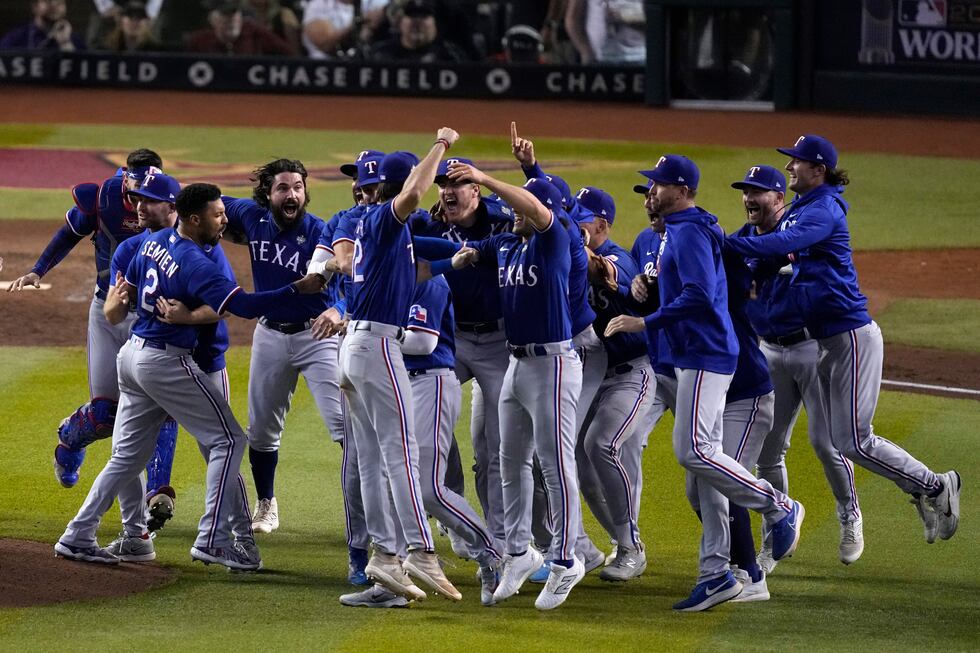 Texas Rangers celebrate after winning Game 5 of the baseball World Series against the Arizona...