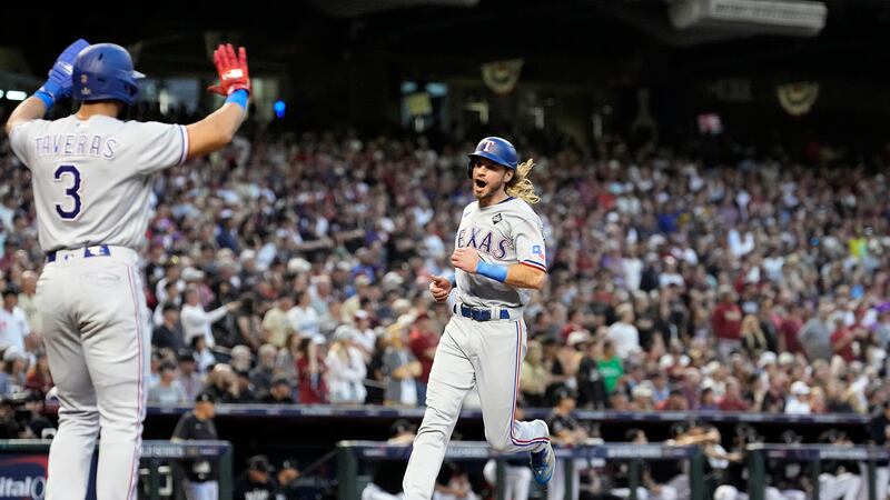Texas Rangers' Travis Jankowski, right, celebrates with Leody Taveras (3) after both scored...