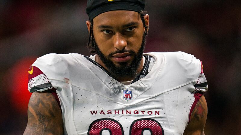 FILE - Washington Commanders defensive end Montez Sweat (90) walks to the locker room during...