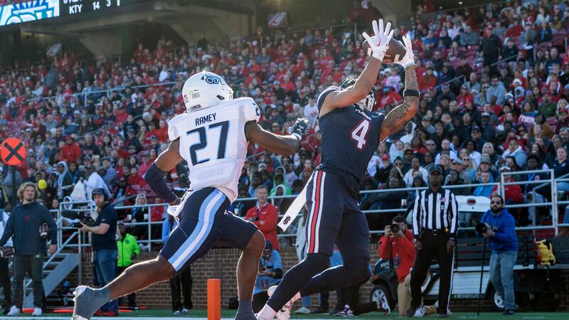 Liberty's CJ Daniels catches a touchdown pass ahead of Old Dominion's Ryan Ramey (27) during...