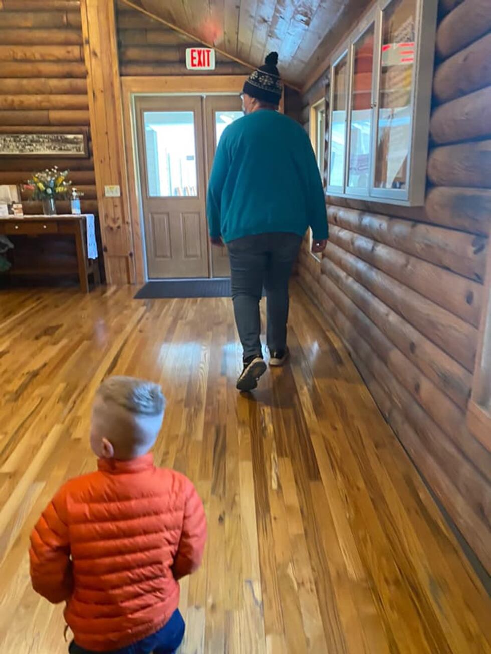 The photo shows the female suspect leading Noah out of the nursery on May 2, 2021 (Giles...